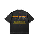 A black short-sleeve t-shirt shown from the back, featuring a graphic print with the text 'CHANGE THE WORLD for the better.' in red, yellow, and white, and 'CLUB COSMO'S' in yellow below it.