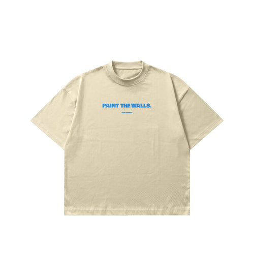 Beige t-shirt with blue text 'PAINT THE WALLS' on a white background