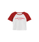 White and red baseball-style women's shirt with 'CLUB COSMO'S 2023' text and heart and star logo on a white background