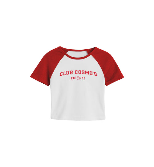 White and red baseball-style women's shirt with 'CLUB COSMO'S 2023' text and heart and star logo on a white background