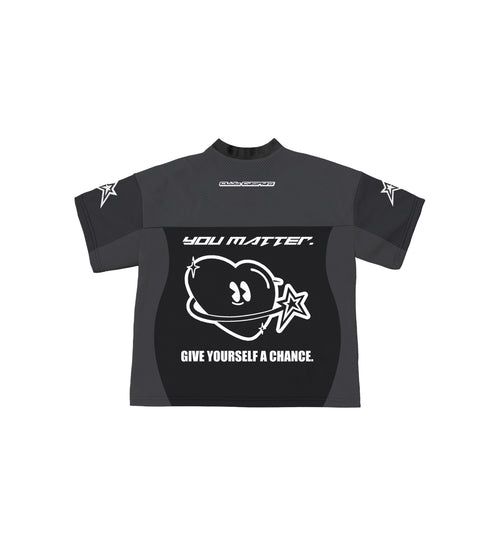 Black sports jersey with white Club Cosmo's graphics and text on a white background.