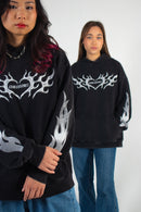 Two models wearing black and silver Club Cosmo's hoodies.