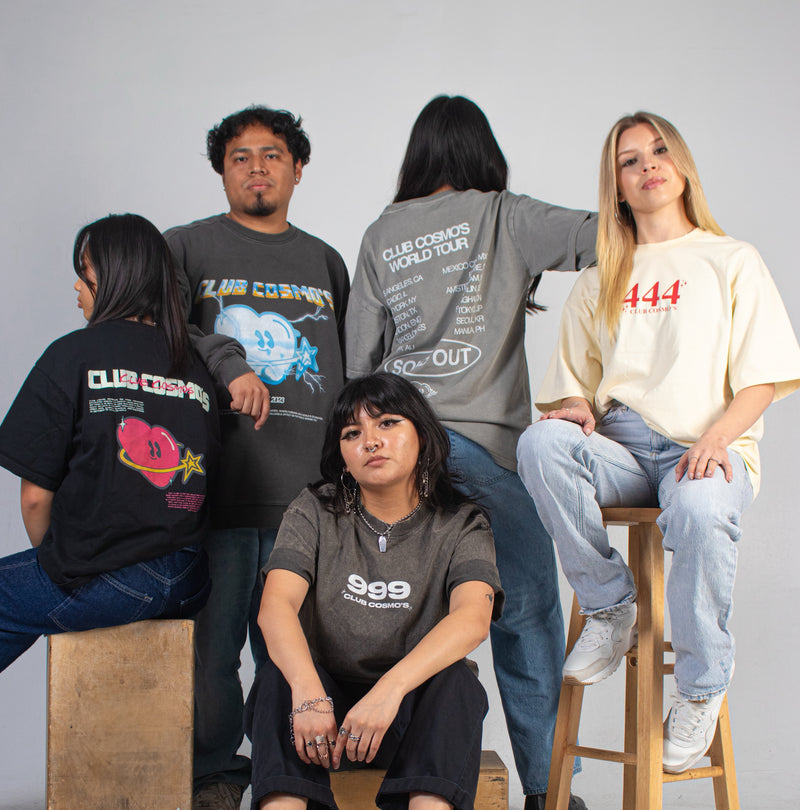 Group of models wearing Club Cosmo's branded clothing against a plain white background.