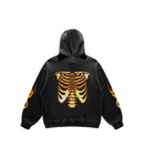 Black hoodie with an orange rib cage skeleton design on the back against a white background.
