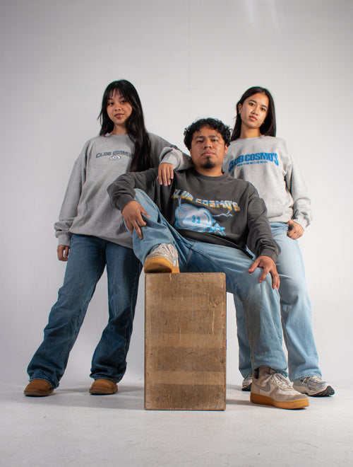 Three models wearing grey Club Cosmo's sweatshirts.