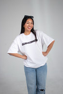 Model wearing a y2k aesthetic white t-shirt with black 'Club Cosmos' text on a white background.